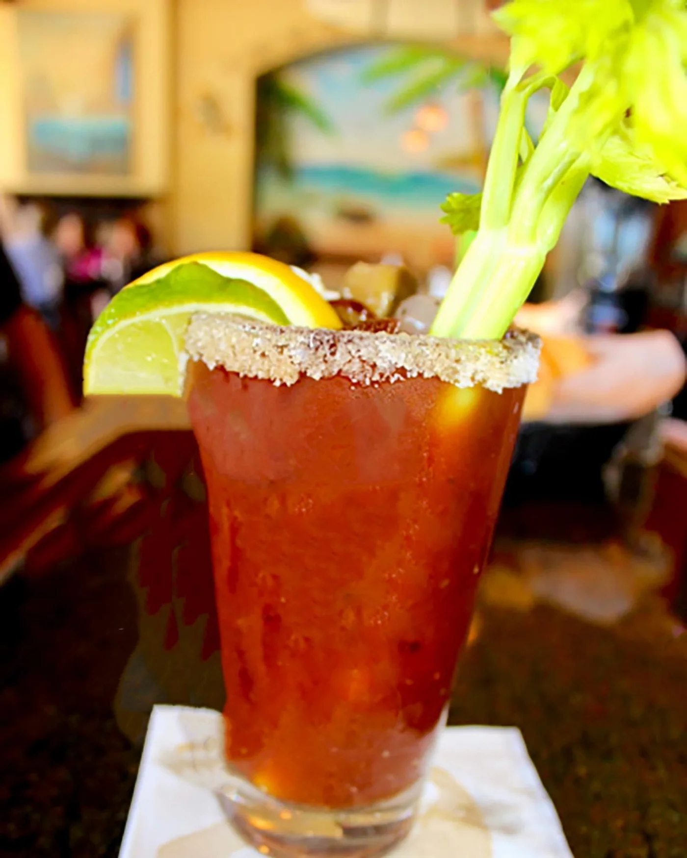 Bloody Mary with a salted rim, celery and citrus