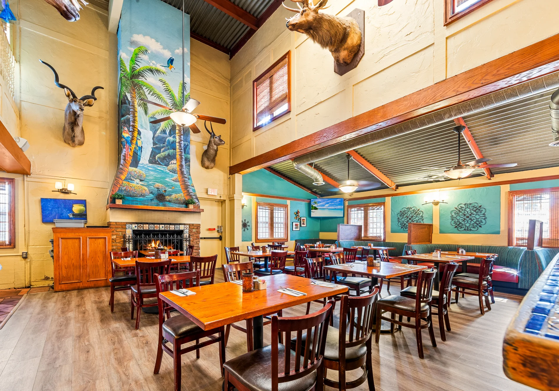 The dining room at Avila's with wood ceilings and warm lighting